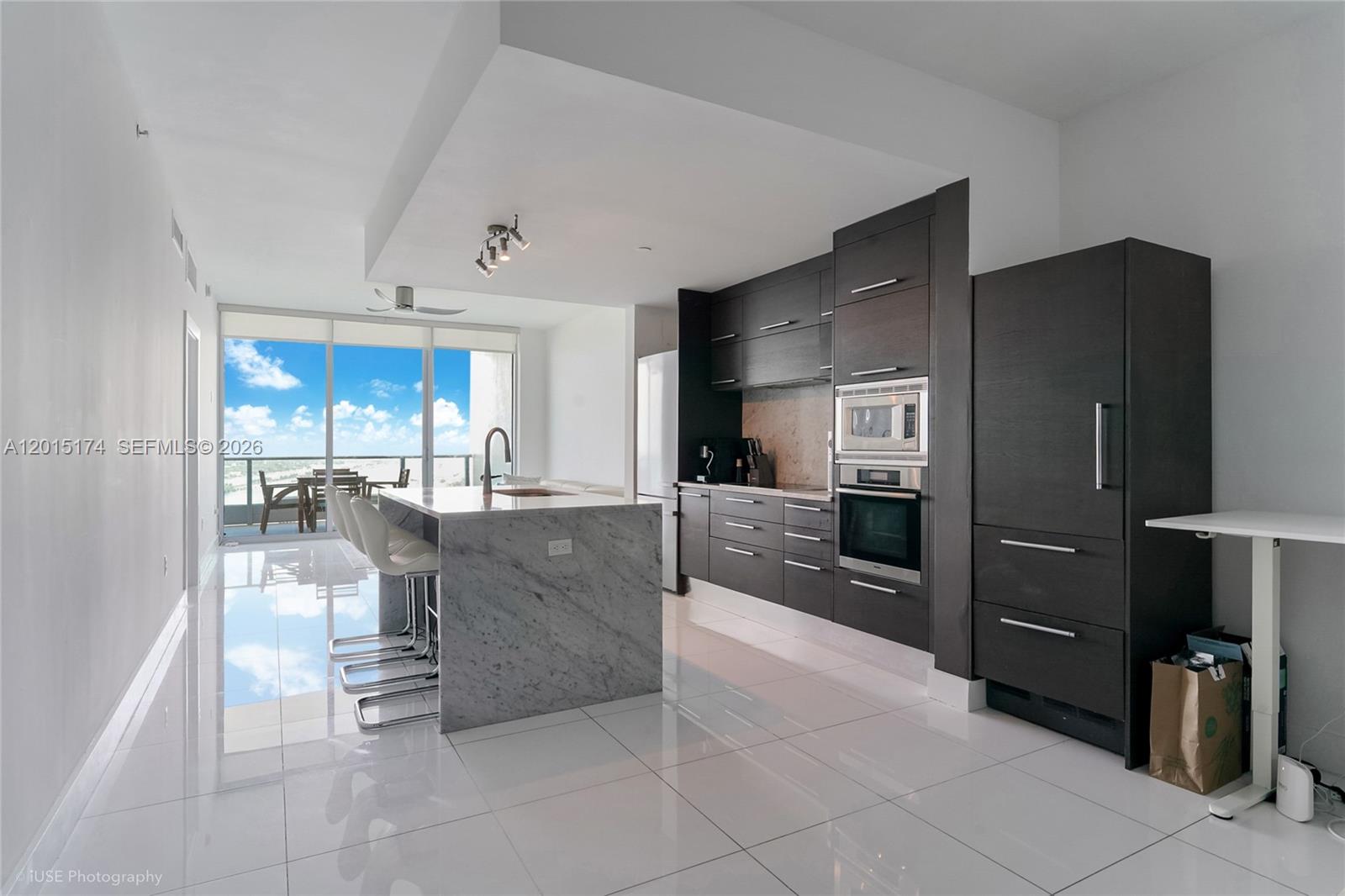 900 Biscayne Boulevard, Unit 3407 Miami, FL 33132 - Photo 1 of 15 a lobby with furniture and a kitchen view