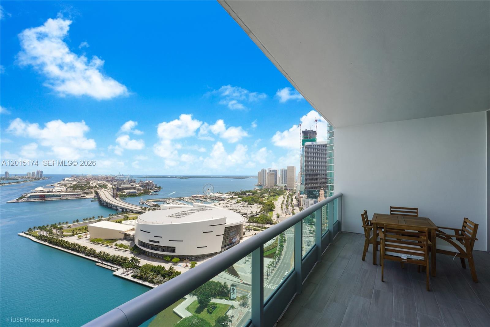 900 Biscayne Boulevard, Unit 3407 Miami, FL 33132 - Photo 14 of 15 a view of a balcony with chairs