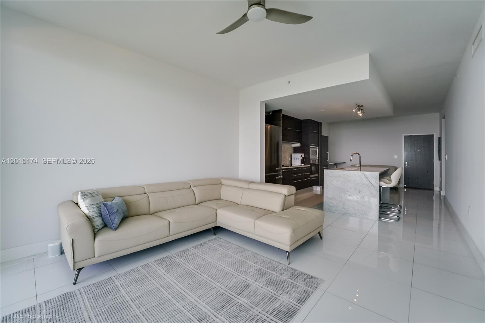 900 Biscayne Boulevard, Unit 3407 Miami, FL 33132 - Photo 8 of 15 a living room with couches and a coffee table