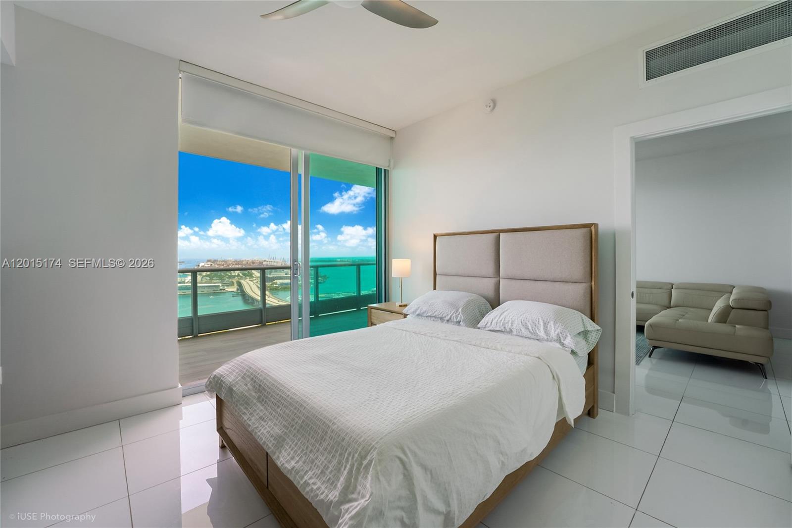 900 Biscayne Boulevard, Unit 3407 Miami, FL 33132 - Photo 9 of 15 a bedroom with a bed and a view of balcony