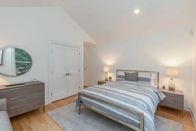 a bedroom with a bed and a dresser