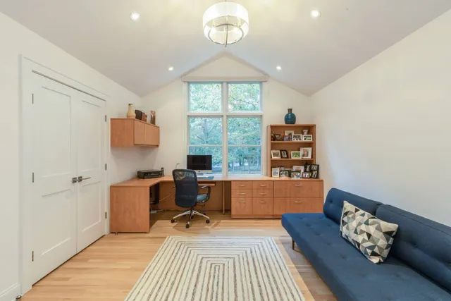 a workspace with furniture hardwood and a window