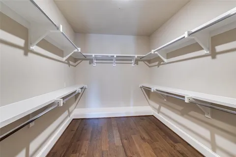 a view of a room with wooden floors