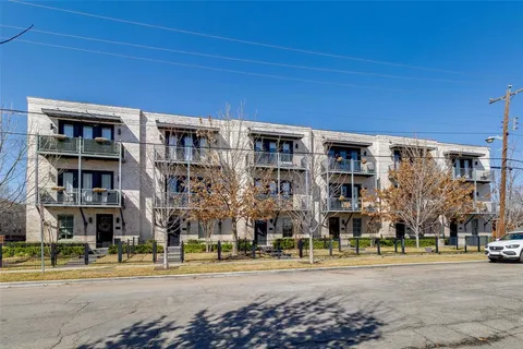 a front view of a building with street view
