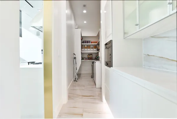 a view of living room with granite countertop and white walls