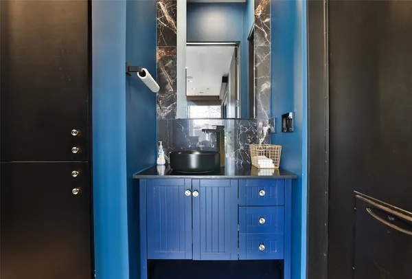 a bathroom with a toilet and shower curtain