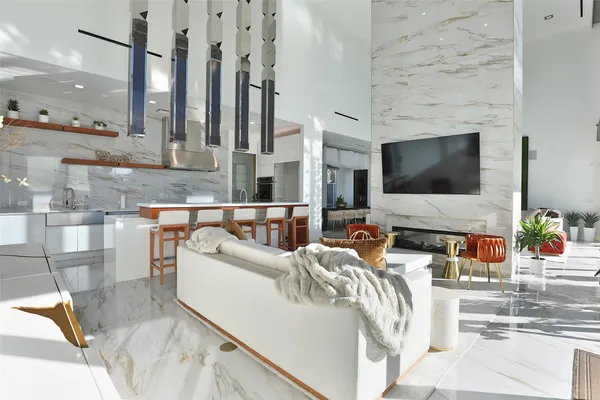 a living room with furniture and large windows