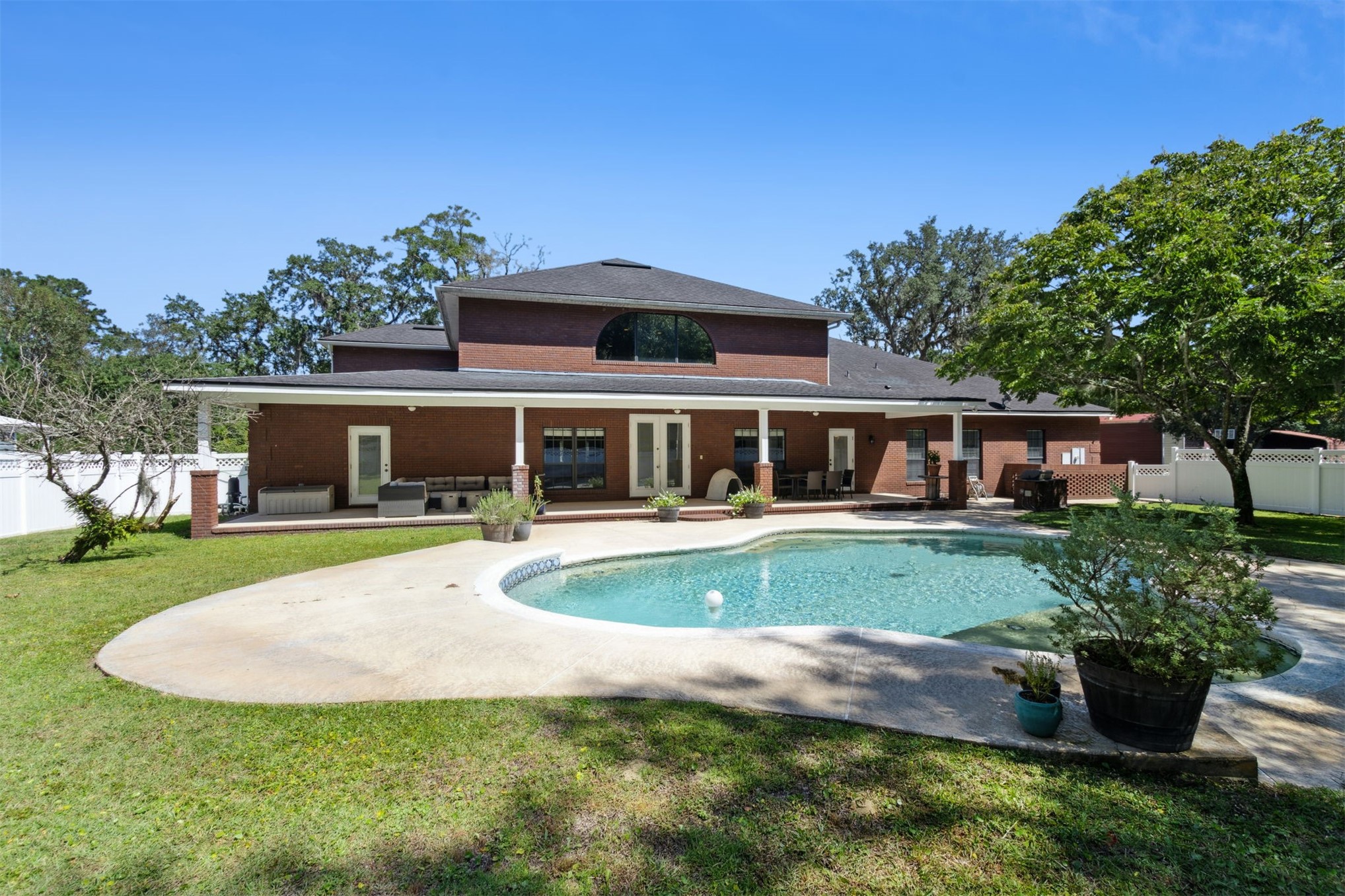 87377 Raddin Road Yulee, FL 32097 - Photo 66 of 75 a front view of a house with a yard