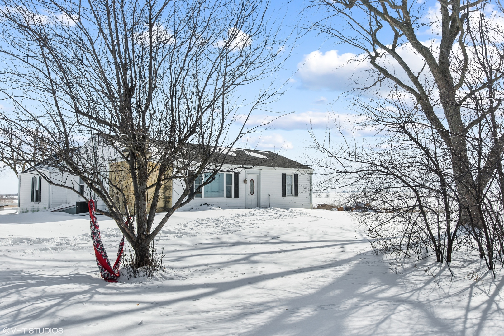 3559 Carlson Road Garden Prairie, IL 61038 - Photo 1 of 17 a view of white house with a yard covered in snow