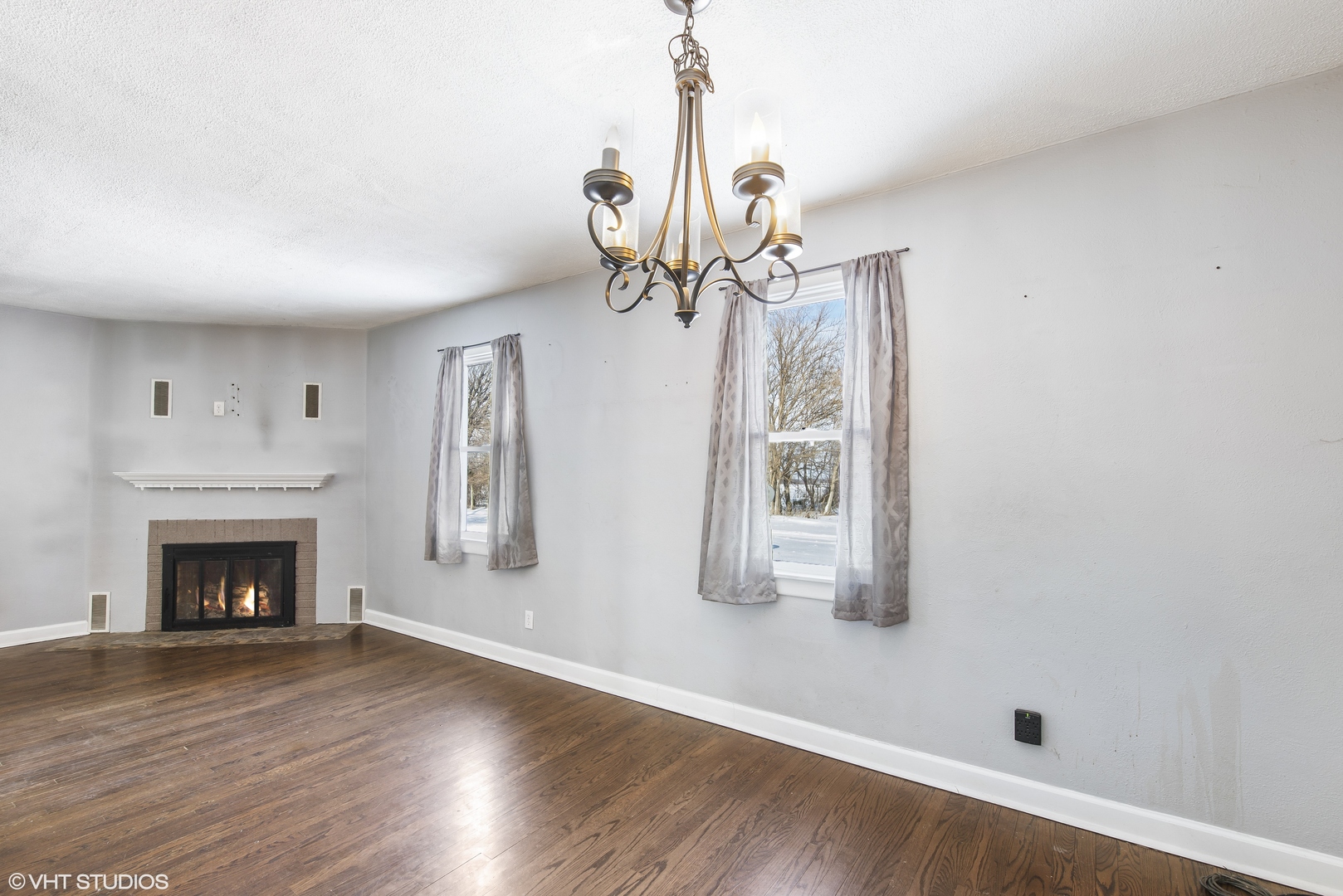 3559 Carlson Road Garden Prairie, IL 61038 - Photo 4 of 17 a living room with wooden floor and a fireplace