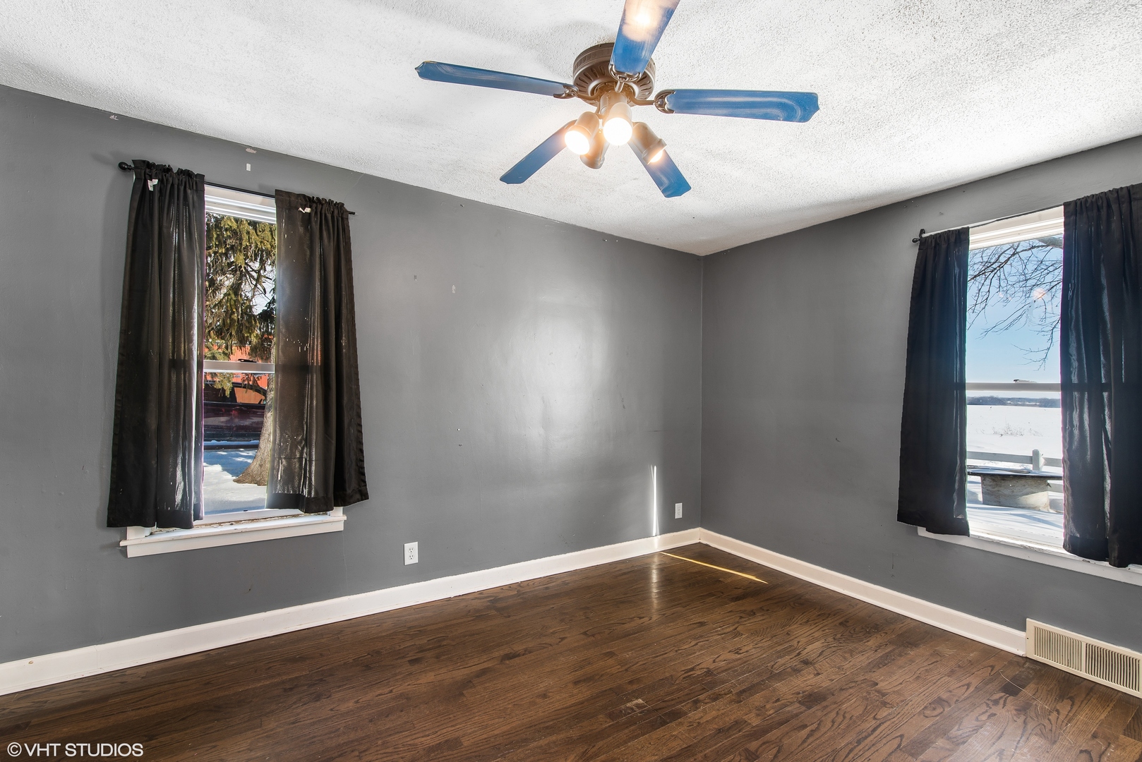3559 Carlson Road Garden Prairie, IL 61038 - Photo 10 of 17 a view of an empty room with wooden floor and a window