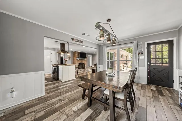 a utility room with dryer washer and a fridge