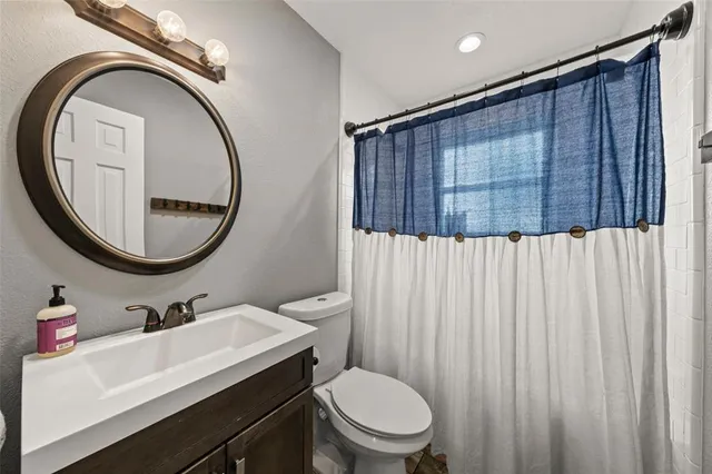 a view of a livingroom with workspace and a window