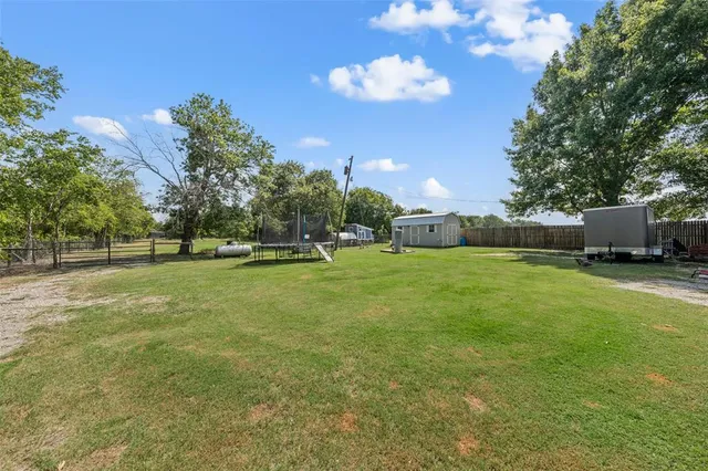 a house view with a backyard space