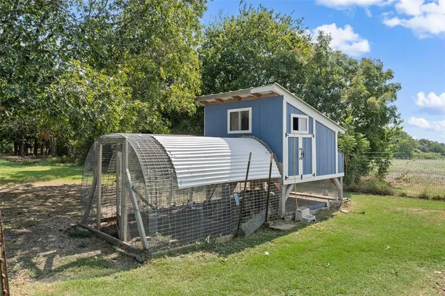 a view of a park with large trees