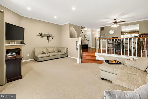 a living room with furniture large window and couch