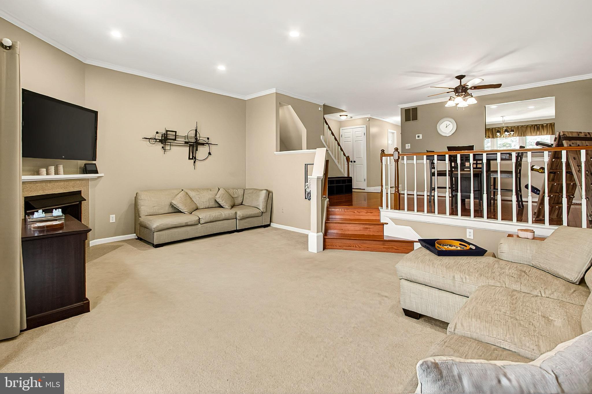 7923 Valleyfield Drive Springfield, VA 22153 - Photo 19 of 51 a living room with furniture and a flat screen tv