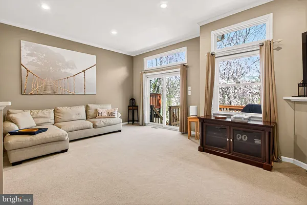 a view of balcony with wooden floor and outdoor seating