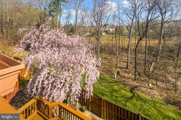 a view of a chairs and table in the balcony