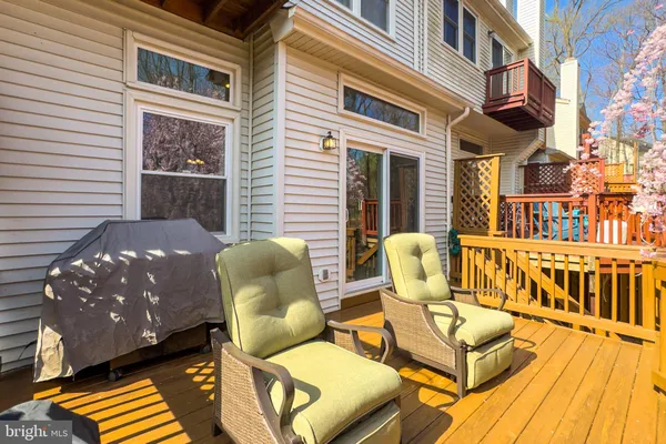 a view of a hallway with a white walls and wooden floor
