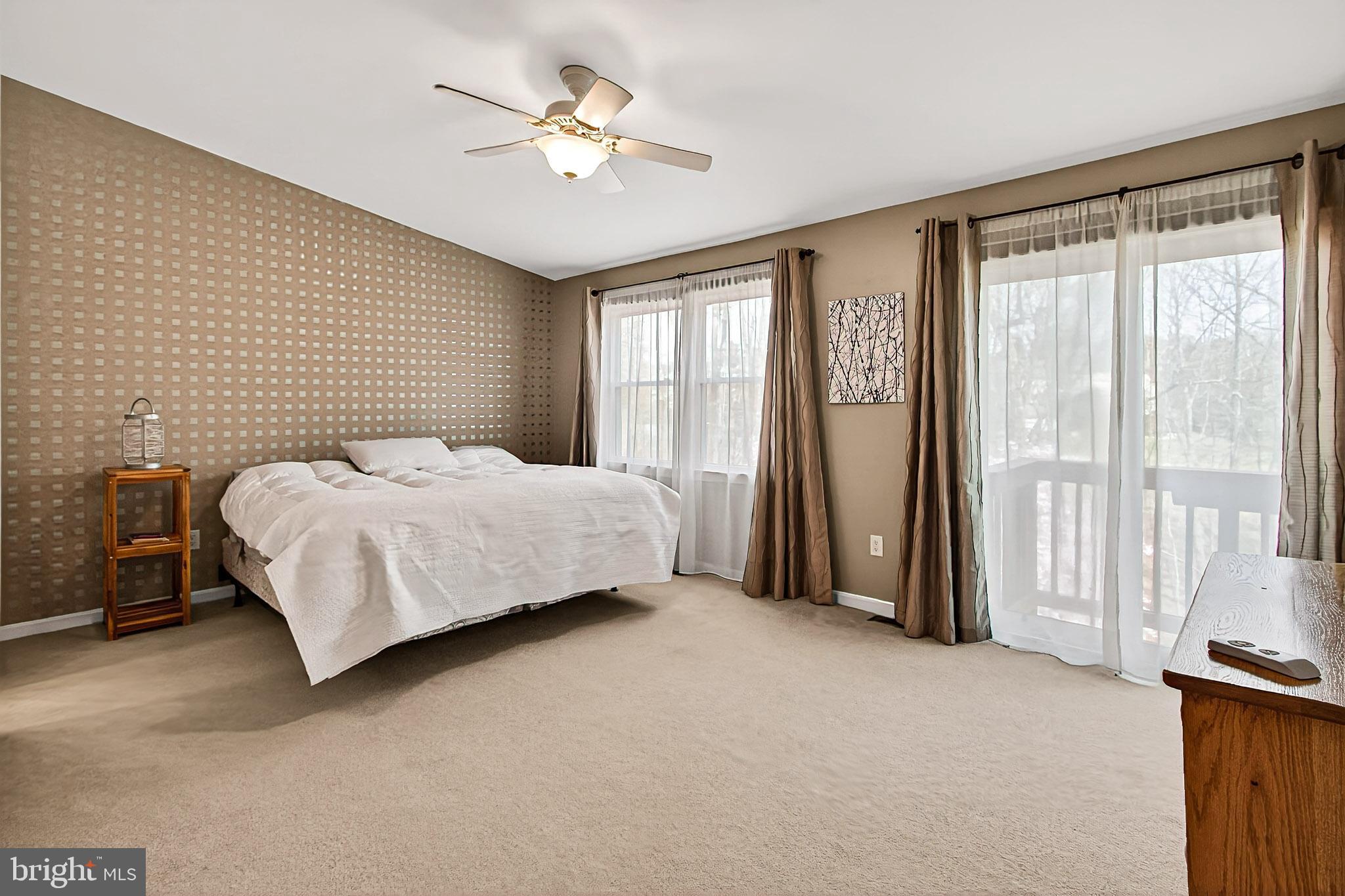 7923 Valleyfield Drive Springfield, VA 22153 - Photo 27 of 51 a bedroom with a bed and a chandelier