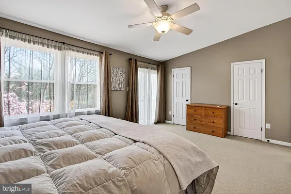 a view of a balcony with yard