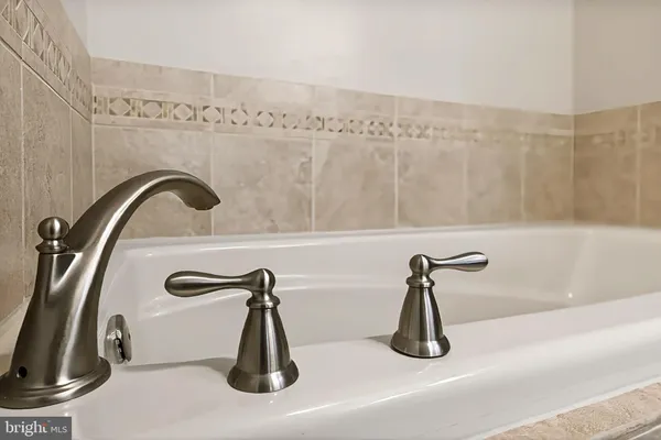 a bedroom with a bed and a tv