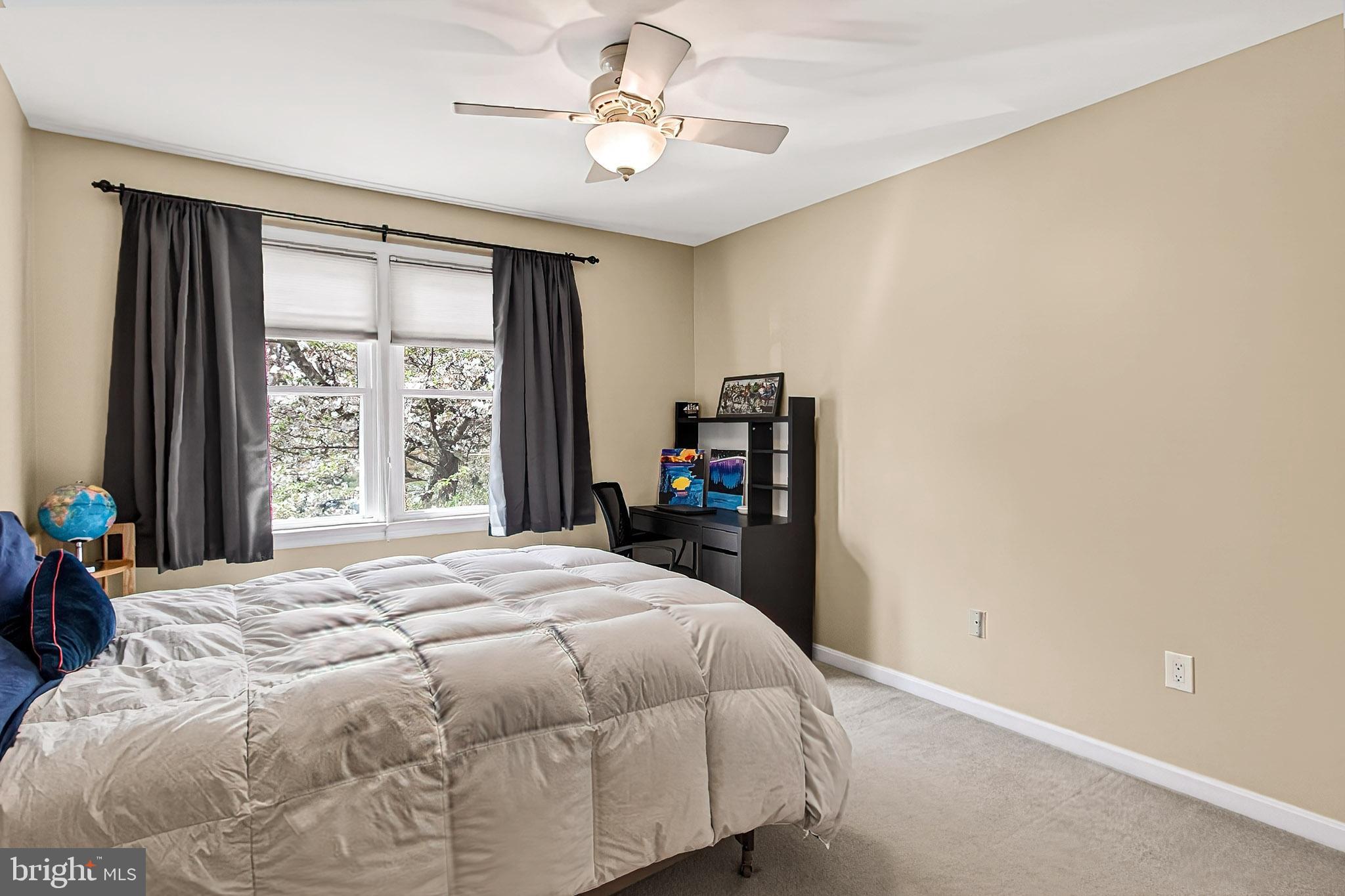 7923 Valleyfield Drive Springfield, VA 22153 - Photo 34 of 51 a bedroom with a bed and a tv