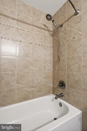 a view of staircase with white walls and a window