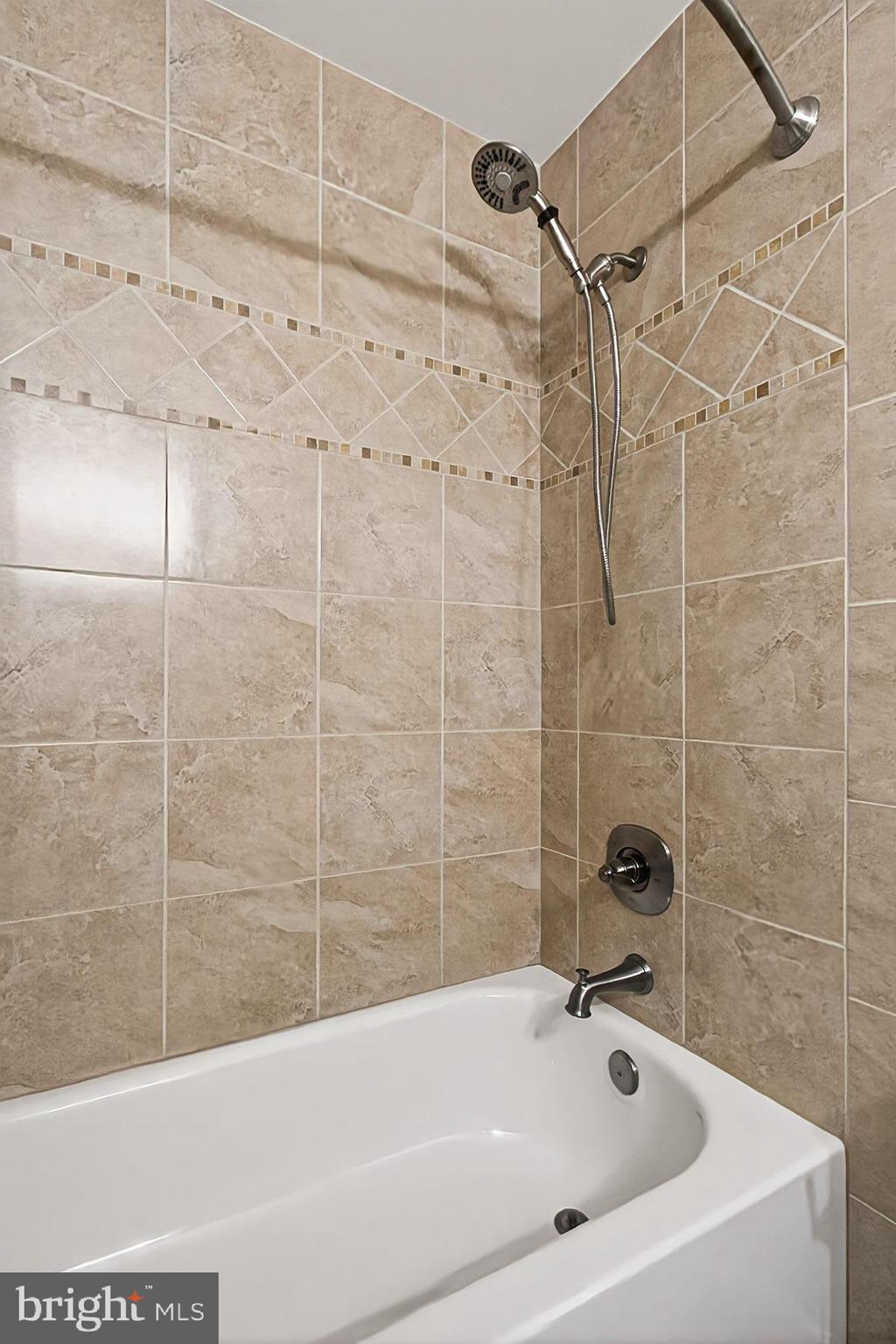 7923 Valleyfield Drive Springfield, VA 22153 - Photo 36 of 51 a bathroom with a bathtub and shower