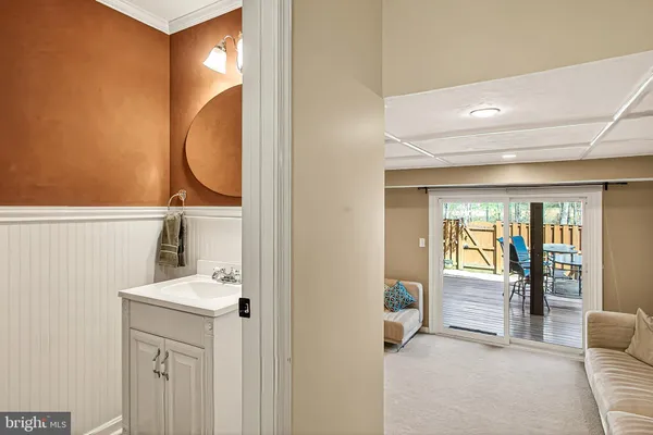 a living room with a couch and a piano table