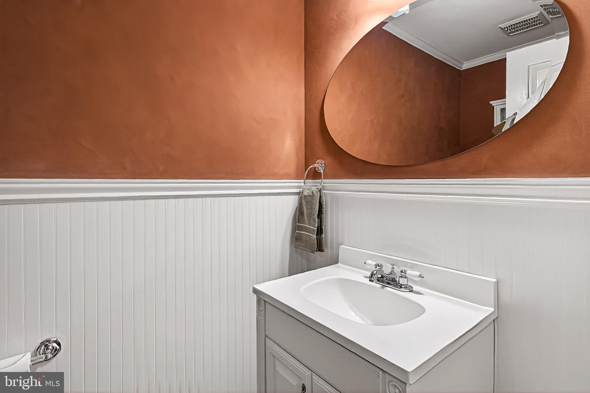 7923 Valleyfield Drive Springfield, VA 22153 - Photo 40 of 51 a bathroom with a sink and mirror