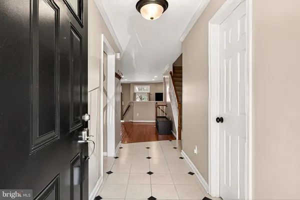 a view of a hallway with a dining room