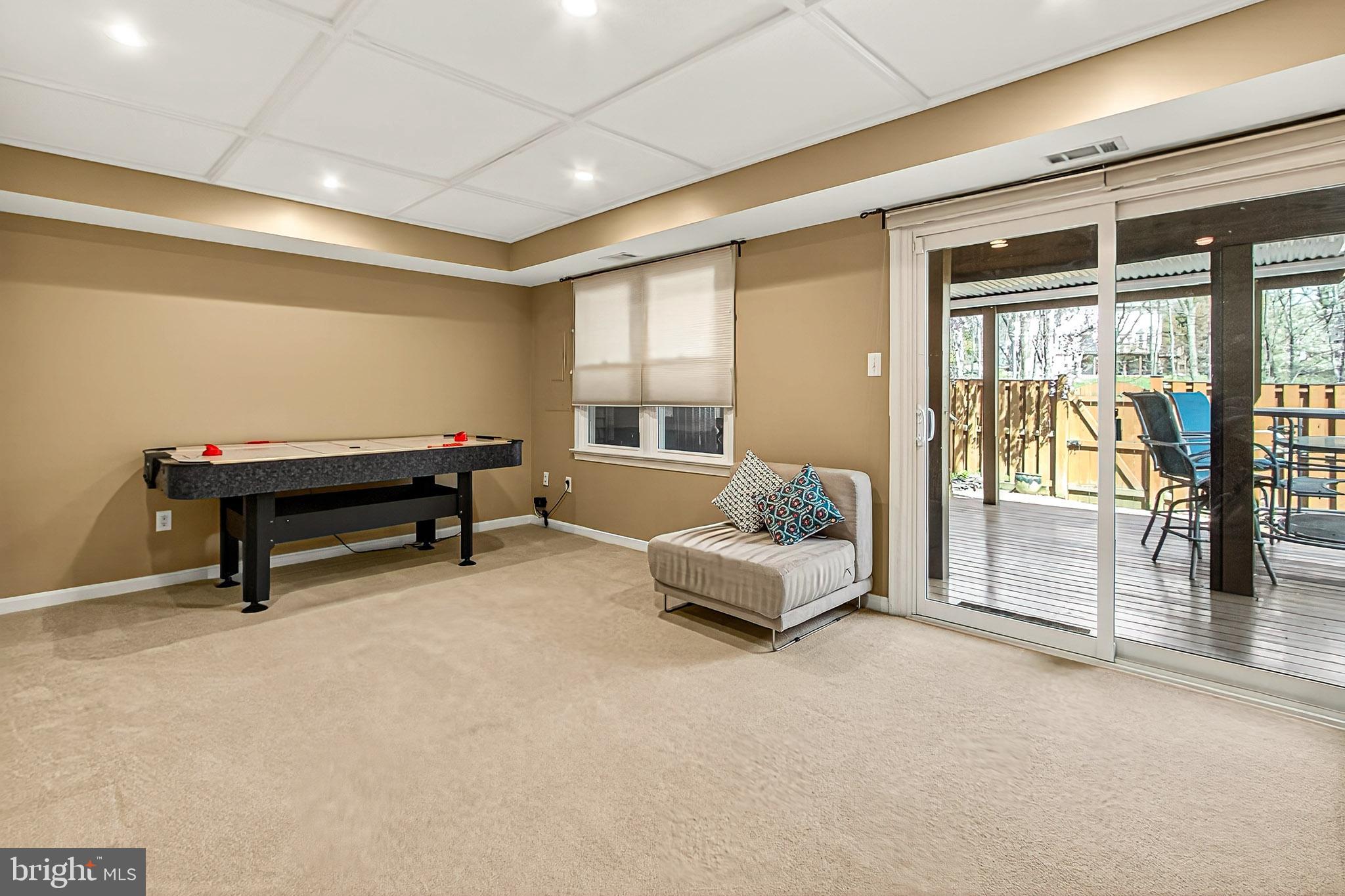 7923 Valleyfield Drive Springfield, VA 22153 - Photo 42 of 51 a living room with furniture gym equipment and a large window