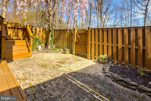 a view of a house with wooden fence