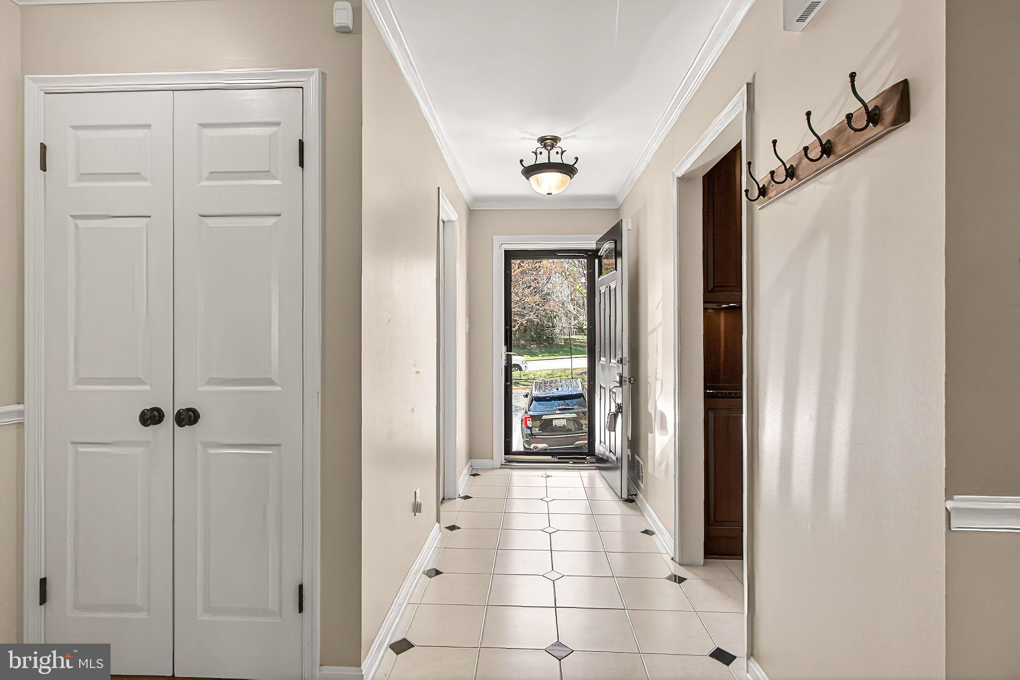 7923 Valleyfield Drive Springfield, VA 22153 - Photo 5 of 51 a view of a hallway with a dining room