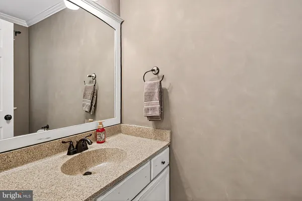 a kitchen with wooden cabinets and stainless steel appliances