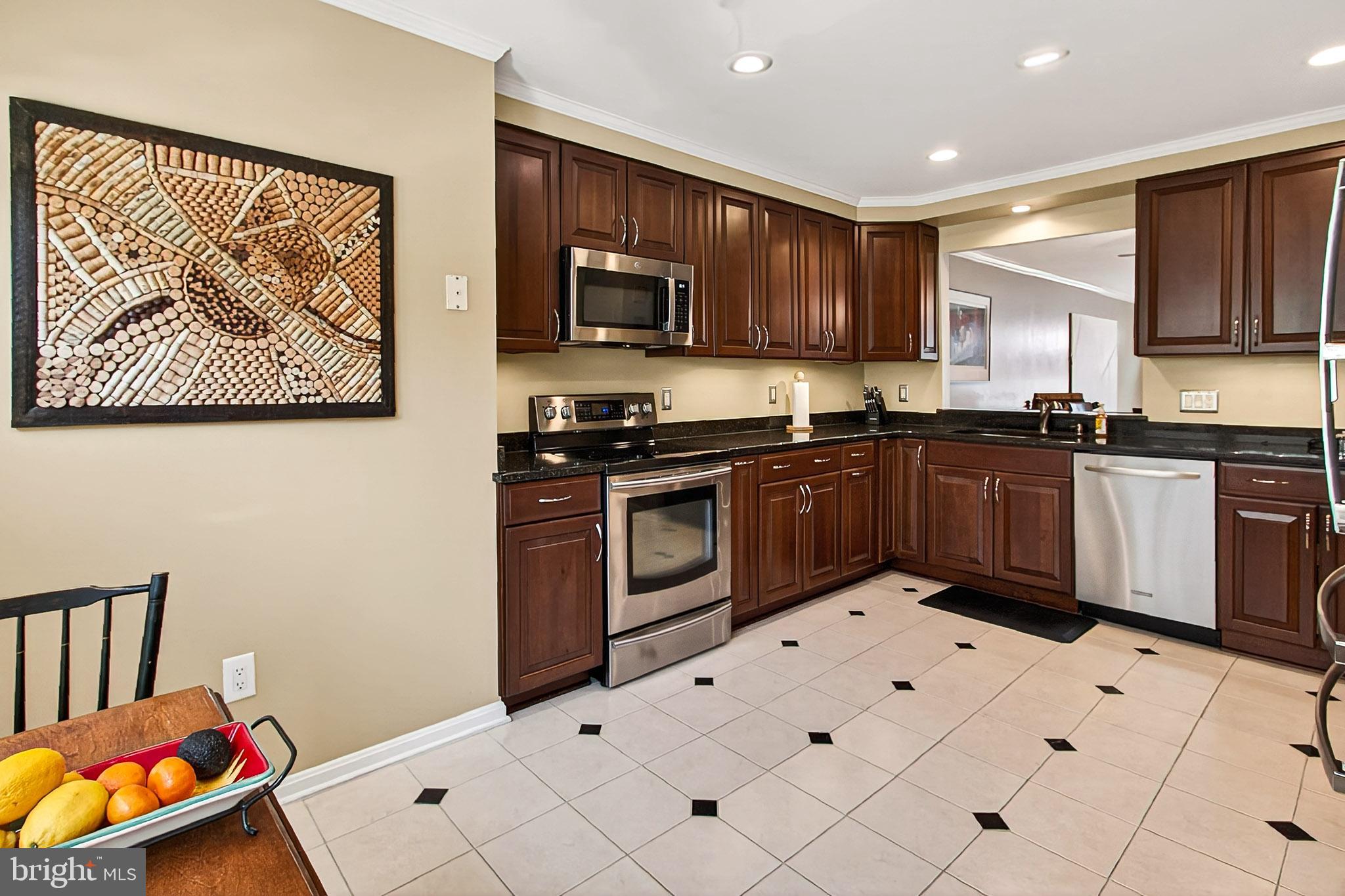 7923 Valleyfield Drive Springfield, VA 22153 - Photo 10 of 51 a kitchen with stainless steel appliances a stove top oven
