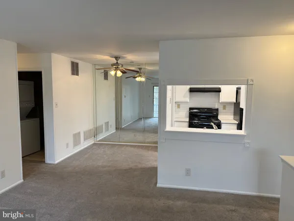 a kitchen with a refrigerator and a stove