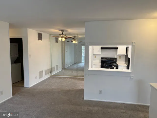 a kitchen with a refrigerator and a stove