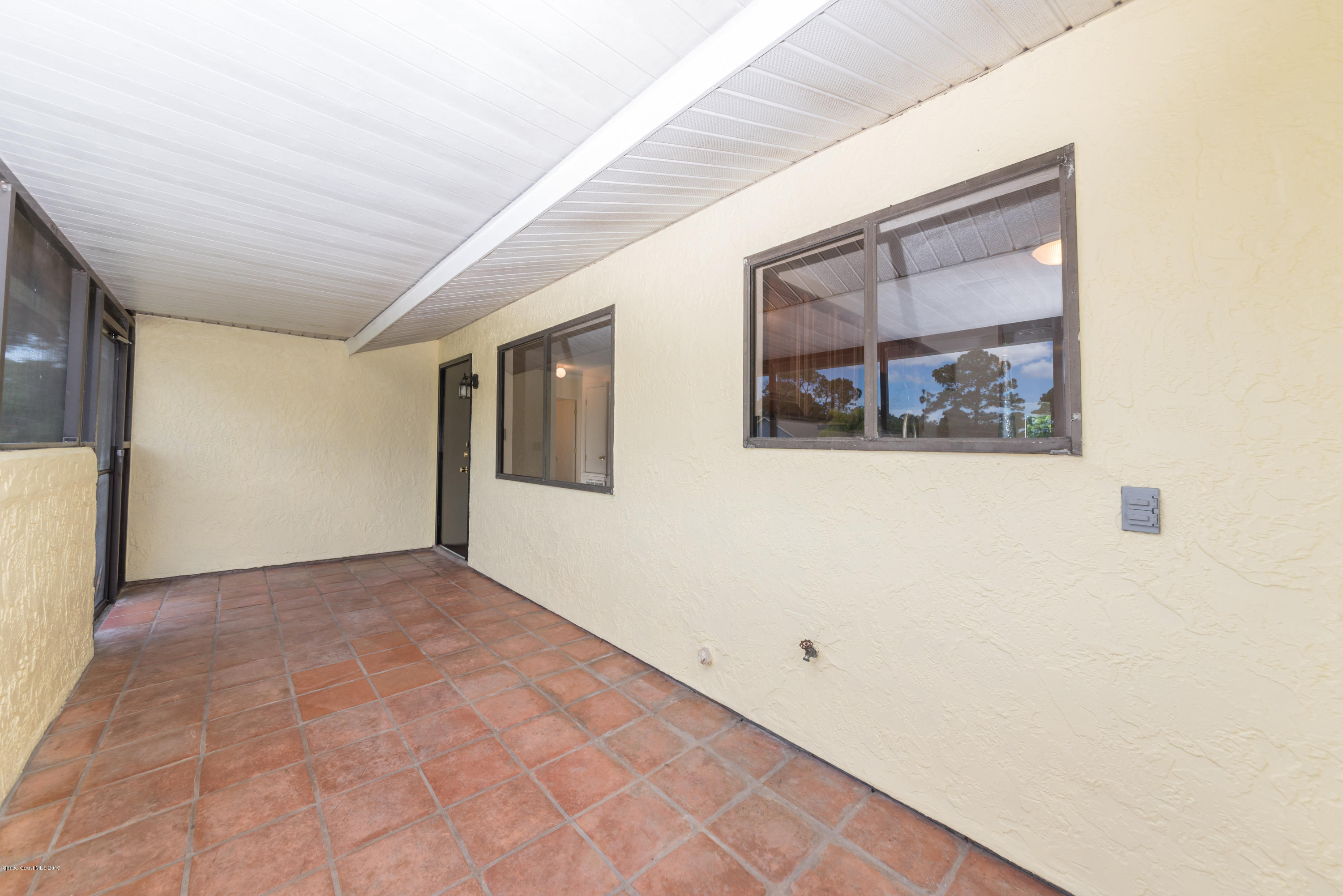 1272 Wabash Road Southeast Palm Bay, FL 32909 - Photo 16 of 18 17 Front Patio View 2