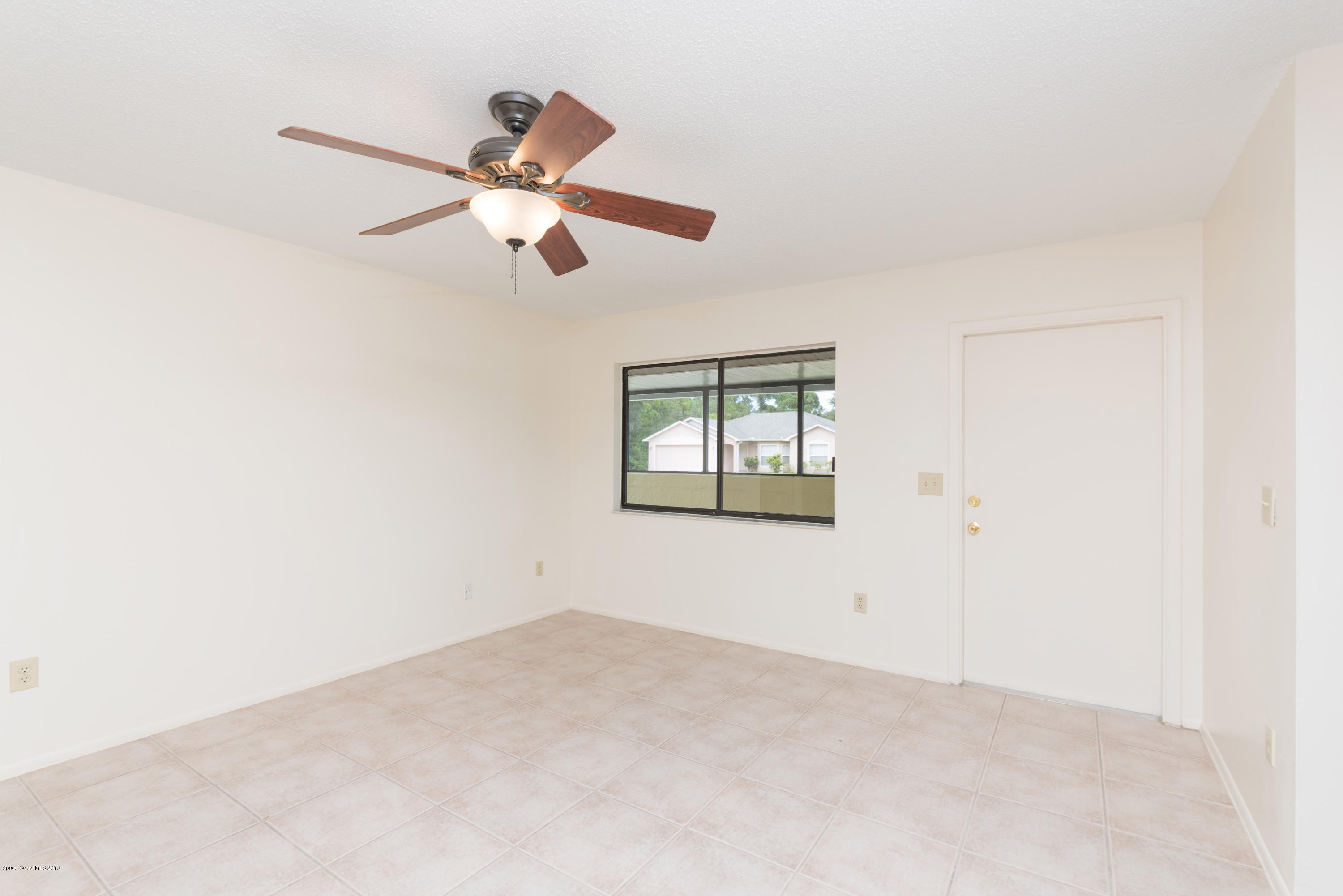 1272 Wabash Road Southeast Palm Bay, FL 32909 - Photo 3 of 18 3 View of Entry & Family Room 2