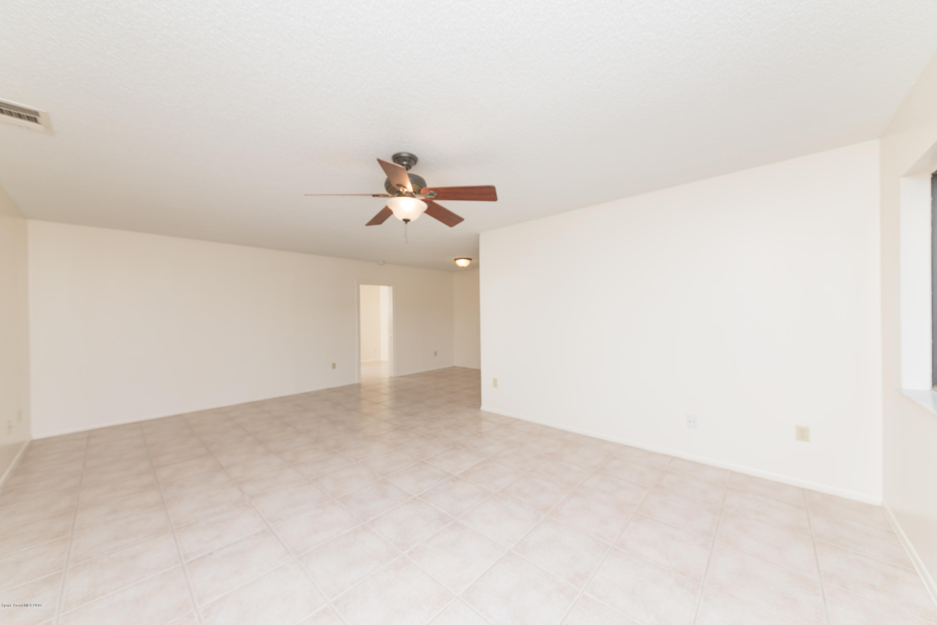 1272 Wabash Road Southeast Palm Bay, FL 32909 - Photo 4 of 18 4 Family & Dining Room 1