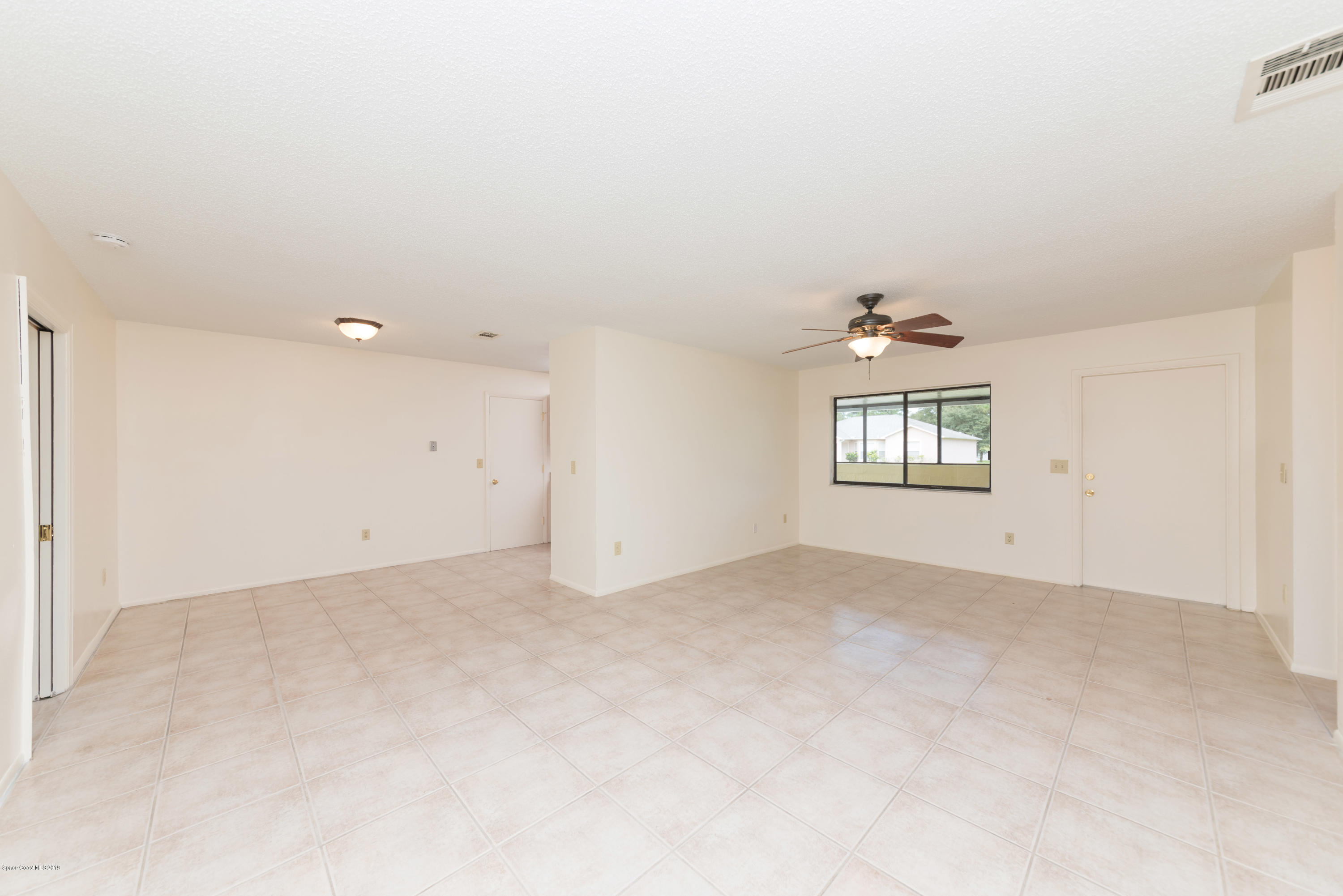 1272 Wabash Road Southeast Palm Bay, FL 32909 - Photo 5 of 18 5 Family & Dining Room 3