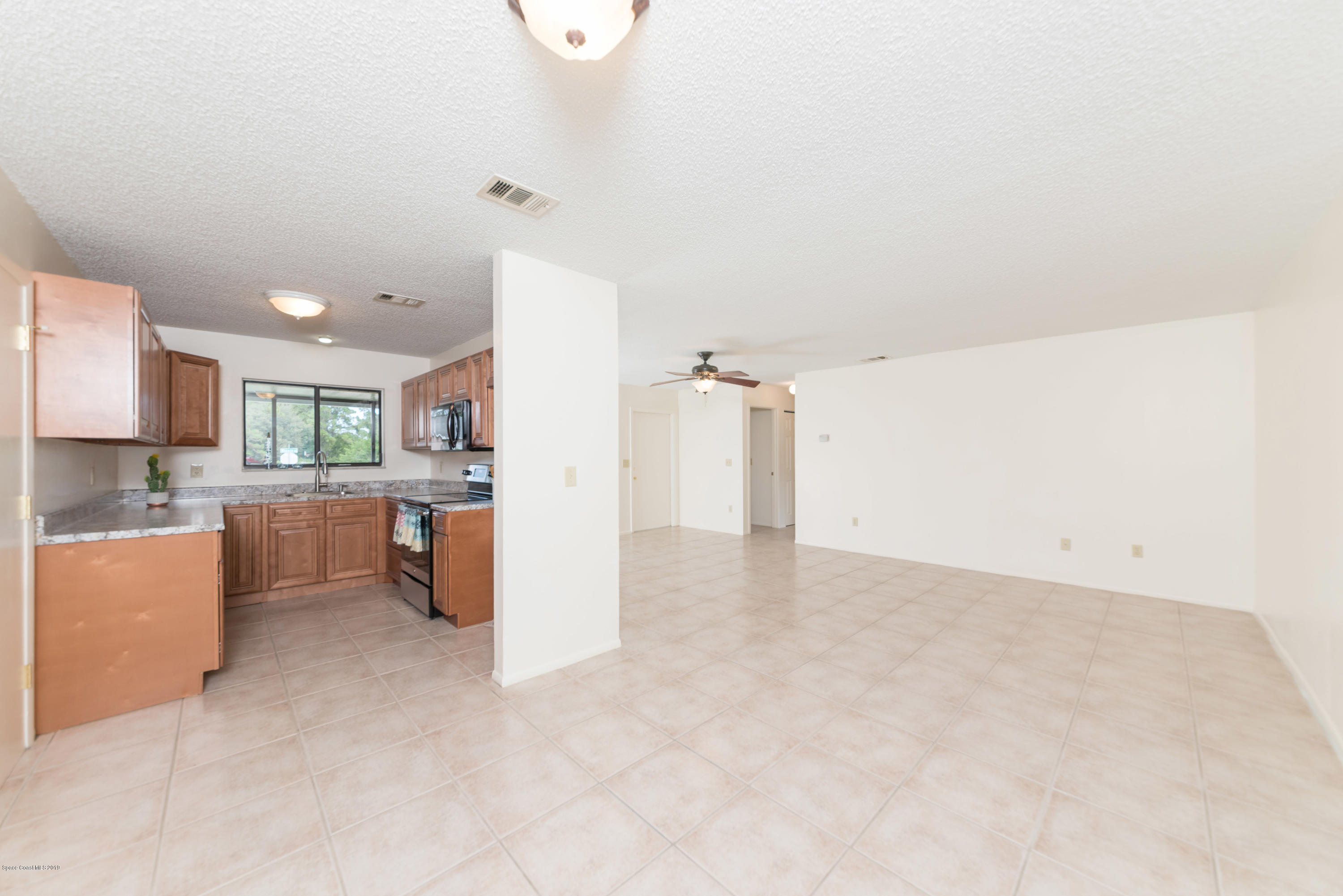 1272 Wabash Road Southeast Palm Bay, FL 32909 - Photo 6 of 18 6 Family & Dining Room 4