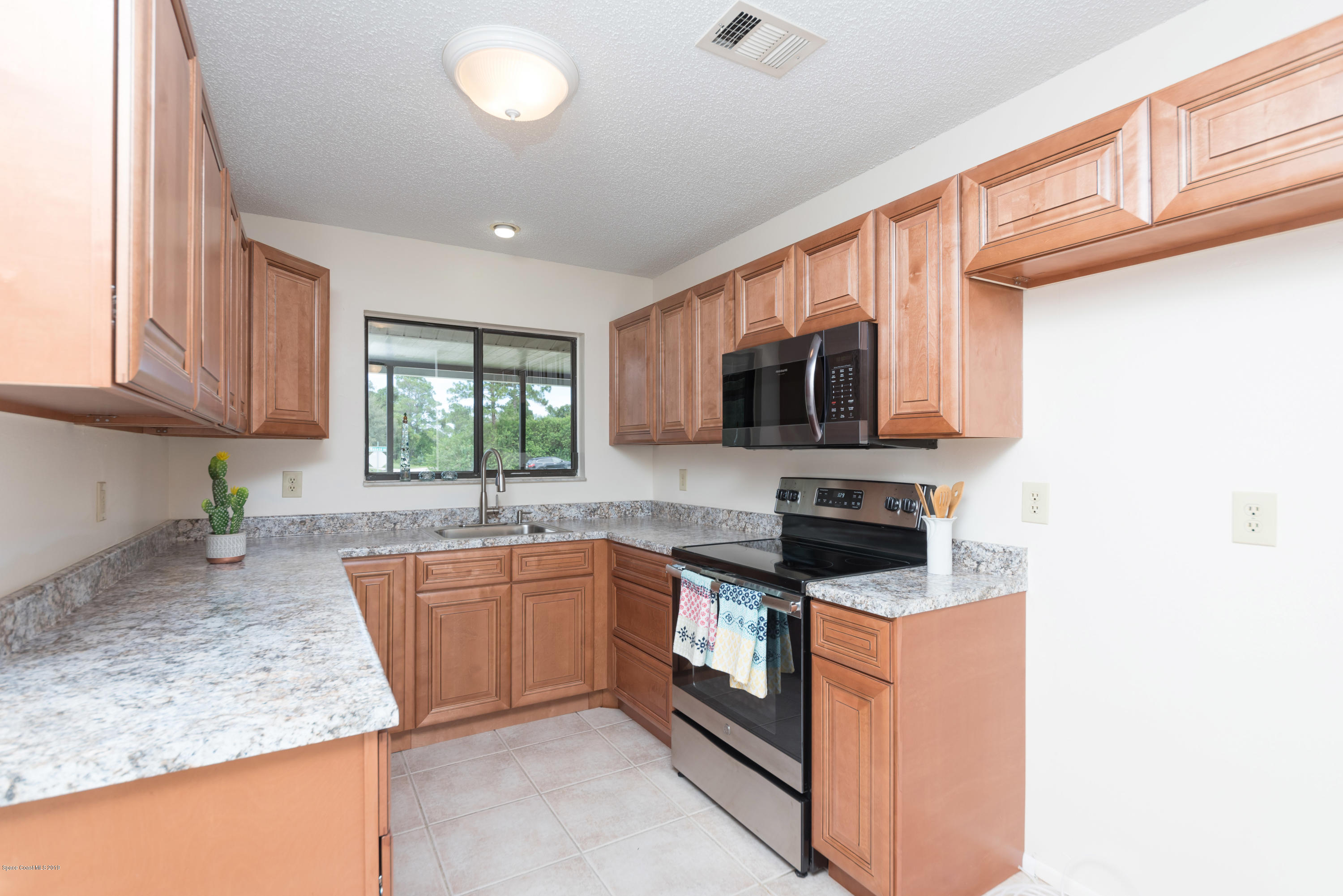 1272 Wabash Road Southeast Palm Bay, FL 32909 - Photo 7 of 18 7 Kitchen View 1