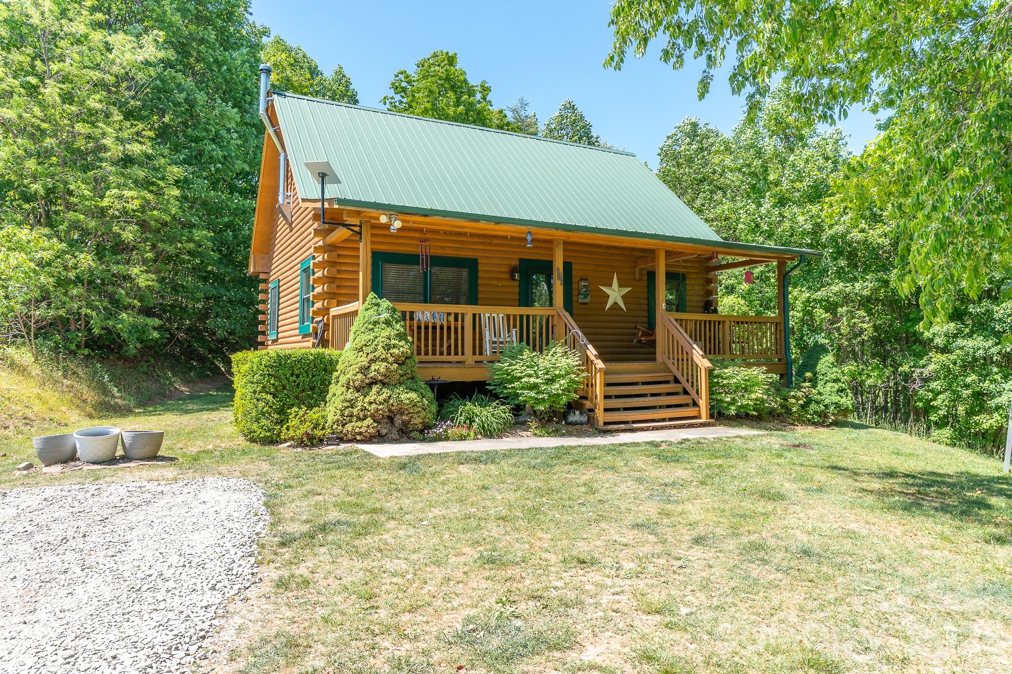 451 Rustic Ridge Drive Canton, NC 28716 - Photo 1 of 44 a front view of a house with a yard