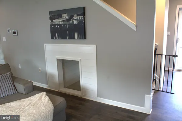 a view of a hallway view with furniture and front door