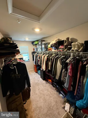 a bedroom with furniture and a mirror