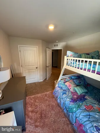 a bedroom with furniture and flat screen tv